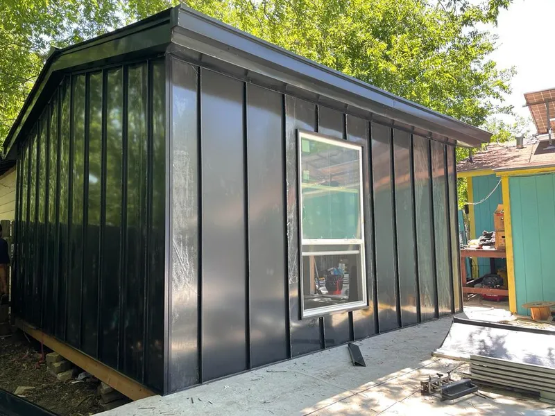 Black standing seam metal wall panels for Metal Roof Installation in Lawrence